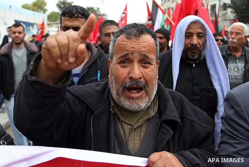 A Palestinian man chants slogans during a rally marking the 46th anniversary of the founding of the Democratic Front for the Liberation of Palestine (DFLP), in Rafah in the southern Gaza Strip February 23, 2015. Photo by...