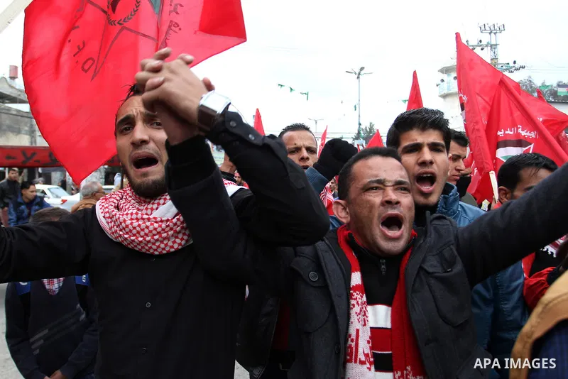 Palestinians chant slogans during a rally marking the 46th anniversary of the founding of the Democratic Front for the Liberation of Palestine (DFLP), in Rafah in the southern Gaza Strip February 23, 2015. Photo by Abed...