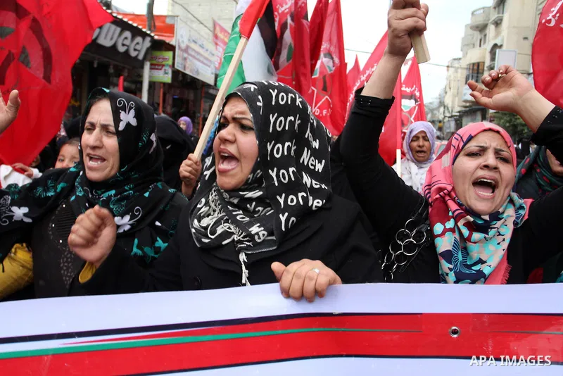 Palestinian women chant slogans during a rally marking the 46th anniversary of the founding of the Democratic Front for the Liberation of Palestine (DFLP), in Rafah in the southern Gaza Strip February 23, 2015. Photo by...