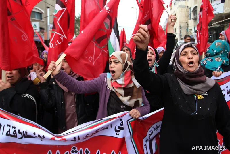 Palestinian women chant slogans during a rally marking the 46th anniversary of the founding of the Democratic Front for the Liberation of Palestine (DFLP), in Rafah in the southern Gaza Strip February 23, 2015. Photo by...