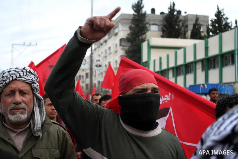 Palestinians chant slogans during a rally marking the 46th anniversary of the founding of the Democratic Front for the Liberation of Palestine (DFLP), in Rafah in the southern Gaza Strip February 23, 2015. Photo by Abed...
