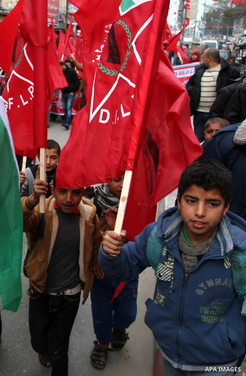 Palestinian children chant slogans during a rally marking the 46th anniversary of the founding of the Democratic Front for the Liberation of Palestine (DFLP), in Rafah in the southern Gaza Strip February 23, 2015. Photo...