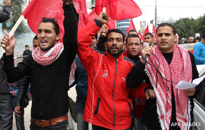 Palestinians chant slogans during a rally marking the 46th anniversary of the founding of the Democratic Front for the Liberation of Palestine (DFLP), in Rafah in the southern Gaza Strip February 23, 2015. Photo by Abed...