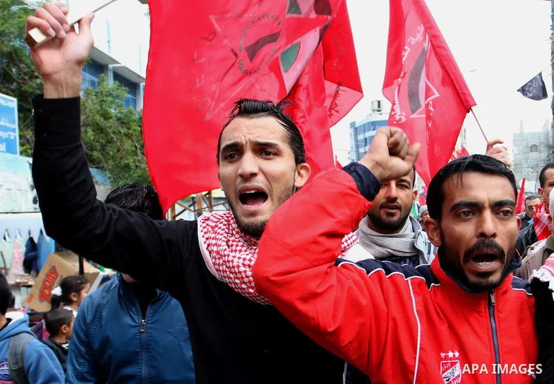 Palestinians chant slogans during a rally marking the 46th anniversary of the founding of the Democratic Front for the Liberation of Palestine (DFLP), in Rafah in the southern Gaza Strip February 23, 2015. Photo by Abed...
