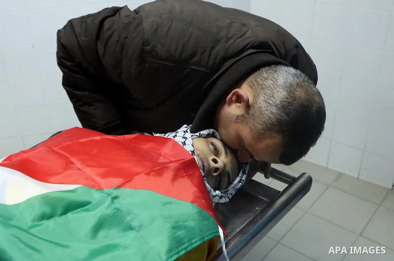 A Relative mourns over the body of Palestinian Jihad al-Jaafari, 19, who was shot dead by Israeli soldiers, at a hospital morgue, in the West Bank city of Bethlehem, on February 24, 2015. Israeli soldiers shot dead al-Ja...
