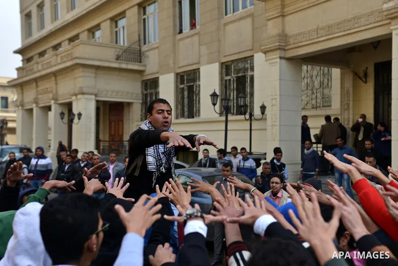 Egyptian students who are support ousted President Mohamed Morsi and the Muslim Brotherhood shout slogans during protest against the military rule, in Cairo University on February 24, 2015. Due to the escalation of stude...