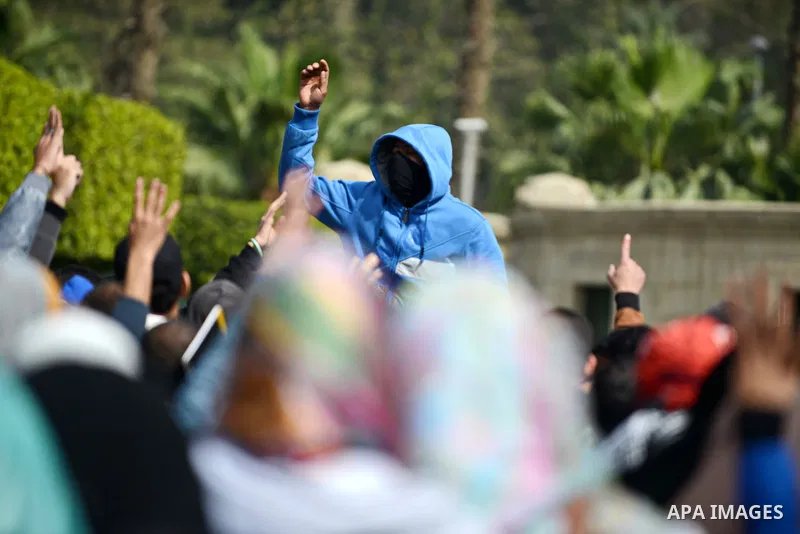 Egyptian students who are support ousted President Mohamed Morsi and the Muslim Brotherhood shout slogans during protest against the military rule, in Cairo University on February 24, 2015. Due to the escalation of stude...