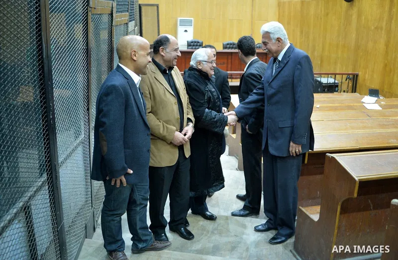 Former premier Ahmed Nazif (R) recieves congratulations as he leave courthouse after he was cleared in retrial on corruption charges, in Cairo, Egypt, 24 February 2015. Cairo Criminal Court acquitted former premier Ahmed...