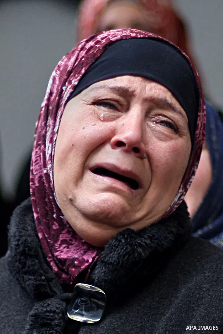 A relative mourns during the funeral of 19-year old Palestinian Jihad al-Jaafari, who was shot dead on the roof of his house after Israeli soldiers entered the Dheishe refugee camp, near the West Bank city of Bethlehem b...