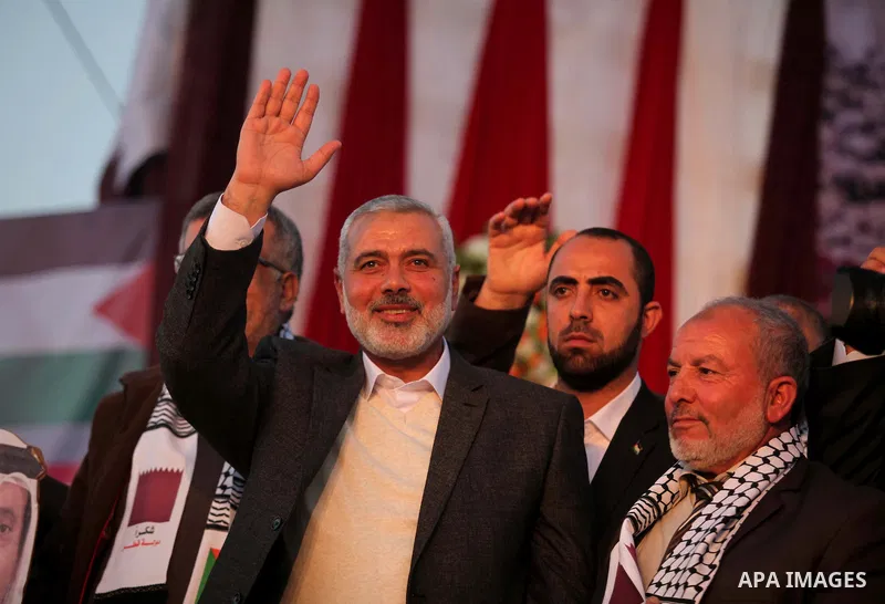 Senior Hamas leader Ismail Haniyeh, attends a mass wedding ceremony in Gaza City, February 27, 2015. 50 couples took part in the a mass wedding aided by Qatar. Photo by Ashraf Amra