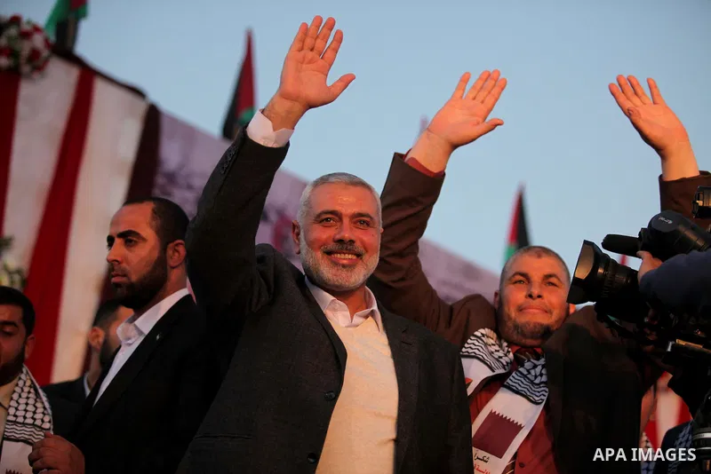 Senior Hamas leader Ismail Haniyeh, attends a mass wedding ceremony in Gaza City, February 27, 2015. 50 couples took part in the a mass wedding aided by Qatar. Photo by Ashraf Amra