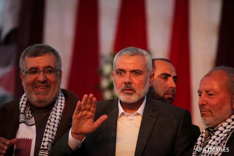 Senior Hamas leader Ismail Haniyeh, attends a mass wedding ceremony in Gaza City, February 27, 2015. 50 couples took part in the a mass wedding aided by Qatar. Photo by Ashraf Amra
