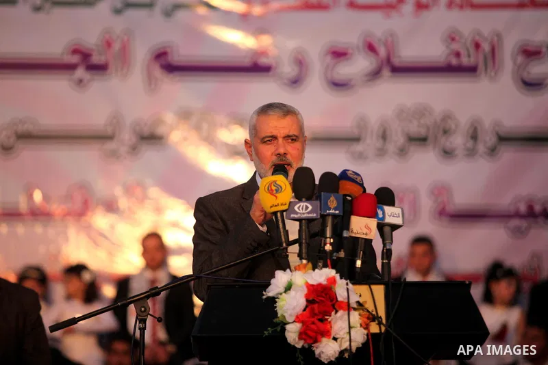 Senior Hamas leader Ismail Haniyeh, gives a speech during a mass wedding ceremony in Gaza City, February 27, 2015. 50 couples took part in the a mass wedding aided by Qatar. Photo by Ashraf Amra