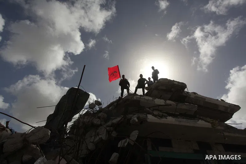 Palestinian supporters of the Popular Front for the Liberation of Palestine (PFLP) take part a protest demanding for reconstruction of houses which were destroyed during the recent Israeli war, in Biet Hanoun in the nort...