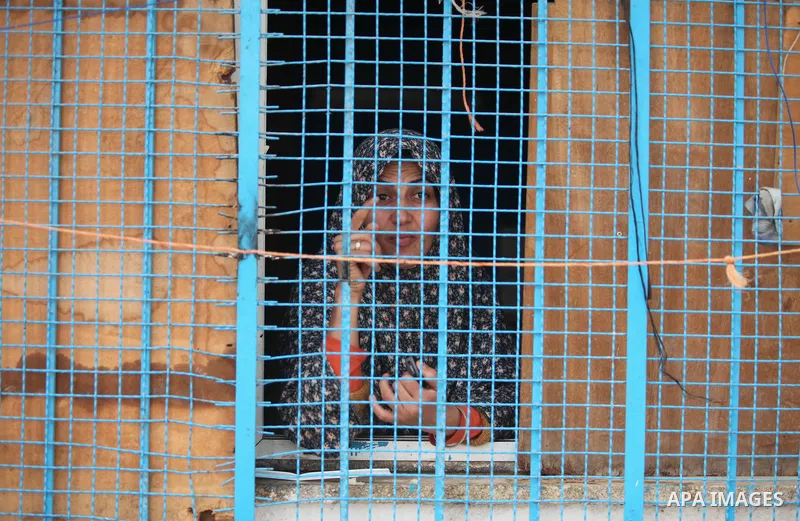 Displaced woman takes shelter at Beit Hanoun School in the northern Gaza Strip February 28, 2015. More than 100,000 homes in the Gaza Strip were damaged or destroyed in Israeli bombardment during the 50-day conflict. A s...