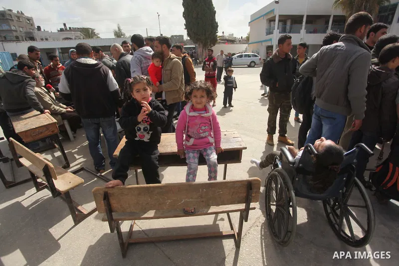 Displaced Palestinians take shelter at Beit Hanoun School in the northern Gaza Strip February 28, 2015. More than 100,000 homes in the Gaza Strip were damaged or destroyed in Israeli bombardment during the 50-day conflic...