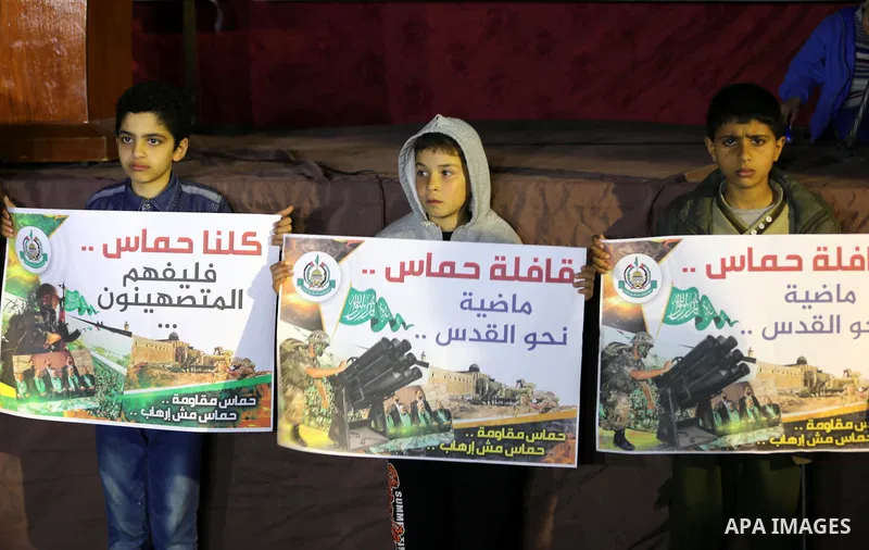 Palestinians take part during a protest to condemn the decision of an Egyptian court as Hamas a "terrorist organization" in Jabalia in the northern Gaza Strip, on February 28, 2015. An Egyptian court declared Hamas a "te...