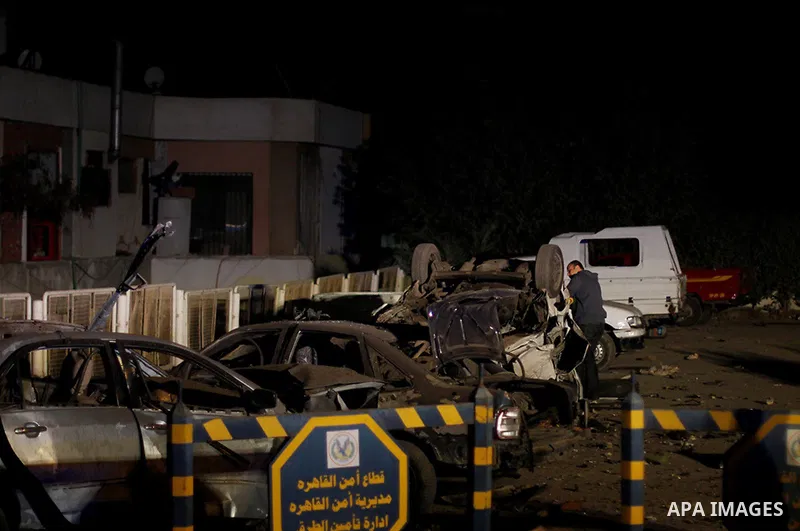 Egyptian security officials inspect the site of an explosion outside the Zahraa El-Maadi police station in Cairo, Egypt, on March 3, 2015. Photo by Amr Sayed