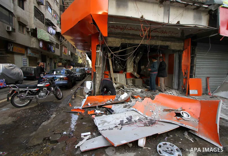 Egyptians inspect the blas site in the district of Al Matariya in eastern Cairo, on March 3, 2015. Five improvised bombs exploded early Tuesday in Cairo's Matariya district in an apparent targeting of Vodafone and Mobini...