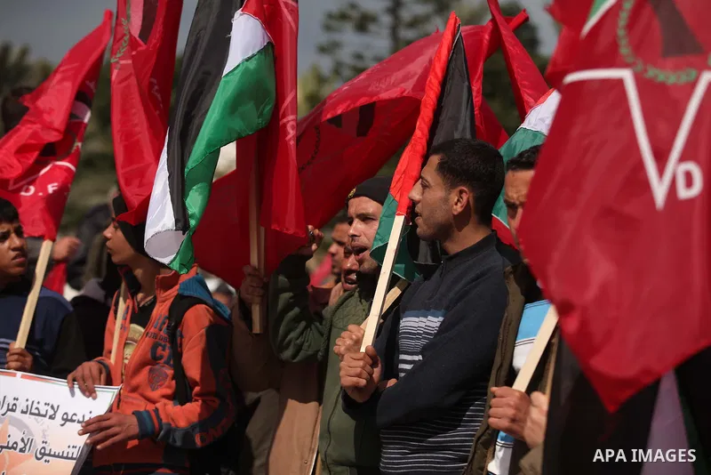 Palestinian supporters of the Popular Front for the Liberation of Palestine (PFLP) take part a protest demanding for reconstruction of houses which were destroyed during the recent Israeli war, in Gaza city, on March 04,...