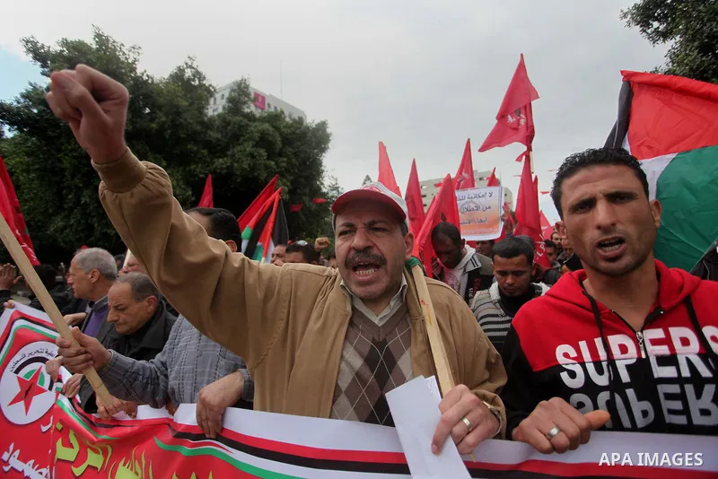 Palestinian supporters of the Popular Front for the Liberation of Palestine (PFLP) take part a protest demanding for reconstruction of houses which were destroyed during the recent Israeli war, in Gaza city, on March 04,...