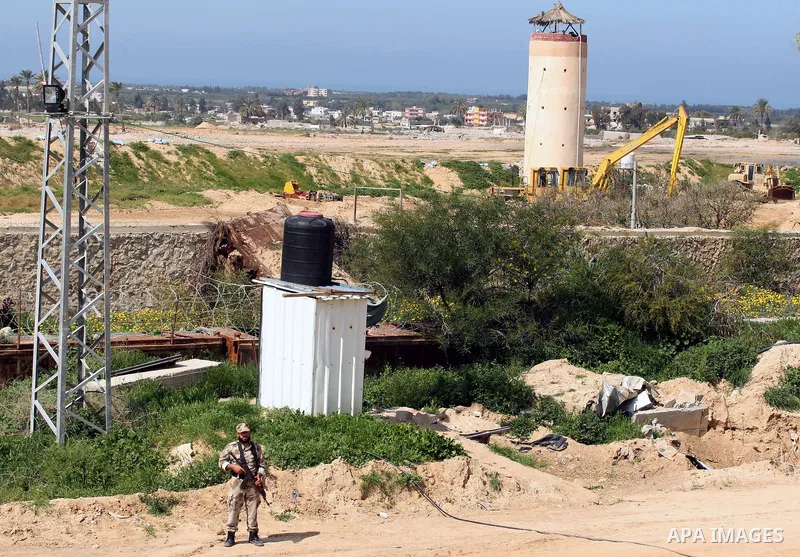 A member of Palestinian security forces stands guard on the border between Egypt and southern Gaza Strip, in Rafah on March 5, 2015. Gaza's border crossings will be reopened once control of them is handed over to the Pal...