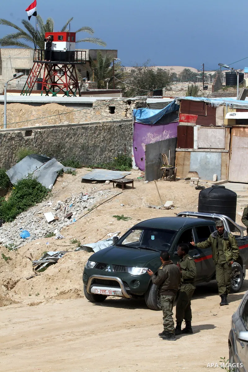 Members of Palestinian security forces stand guard on the border between Egypt and southern Gaza Strip, in Rafah on March 5, 2015. Gaza's border crossings will be reopened once control of them is handed over to the Pales...