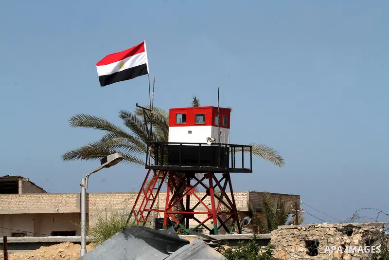 An Egyptian security guard on duty in a watch tower at the border between Egypt and southern Gaza Strip, on March 5, 2015. Gaza's border crossings will be reopened once control of them is handed over to the Palestinian A...