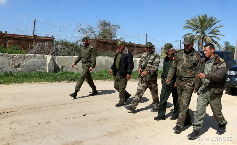 Members of Palestinian security forces patrol on the border between Egypt and southern Gaza Strip, in Rafah on March 5, 2015. Gaza's border crossings will be reopened once control of them is handed over to the Palestinia...