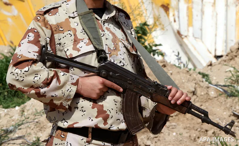 A member of Palestinian security forces stands guard on the border between Egypt and southern Gaza Strip, in Rafah on March 5, 2015. Gaza's border crossings will be reopened once control of them is handed over to the Pal...