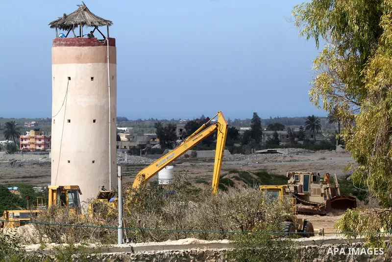 An Egyptian security guard on duty in a watch tower at the border between Egypt and southern Gaza Strip, on March 5, 2015. Gaza's border crossings will be reopened once control of them is handed over to the Palestinian A...