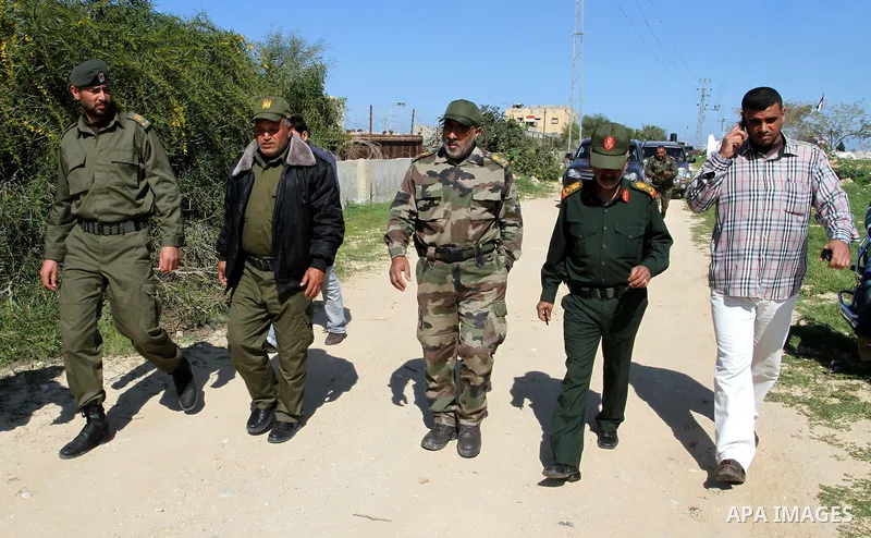 Members of Palestinian security forces patrol on the border between Egypt and southern Gaza Strip, in Rafah on March 5, 2015. Gaza's border crossings will be reopened once control of them is handed over to the Palestinia...