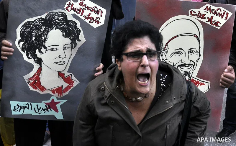 Egyptian demonstrators shout slogans during a demonstration in Cairo on March 05, 2015 protesting the killing of Shaima al-Sabbagh. Al-Sabbagh who was killed in clashes with Egyptian police during a rare leftwing protest...
