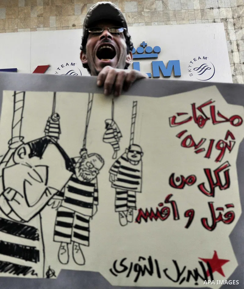 Egyptian demonstrators shout slogans during a demonstration in Cairo on March 05, 2015 protesting the killing of Shaima al-Sabbagh. Al-Sabbagh who was killed in clashes with Egyptian police during a rare leftwing protest...