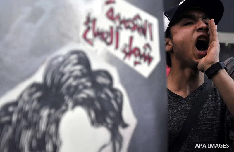 Egyptian demonstrators shout slogans during a demonstration in Cairo on March 05, 2015 protesting the killing of Shaima al-Sabbagh. Al-Sabbagh who was killed in clashes with Egyptian police during a rare leftwing protest...