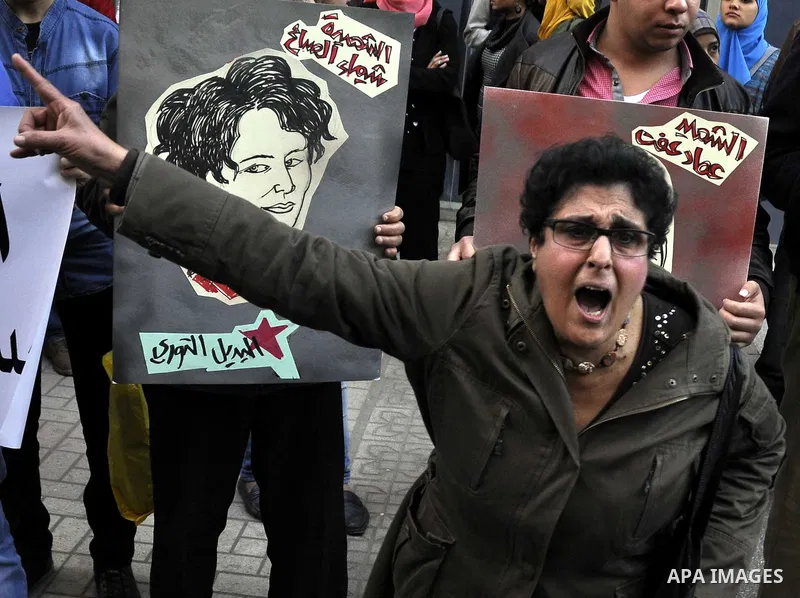 Egyptian demonstrators shout slogans during a demonstration in Cairo on March 05, 2015 protesting the killing of Shaima al-Sabbagh. Al-Sabbagh who was killed in clashes with Egyptian police during a rare leftwing protest...
