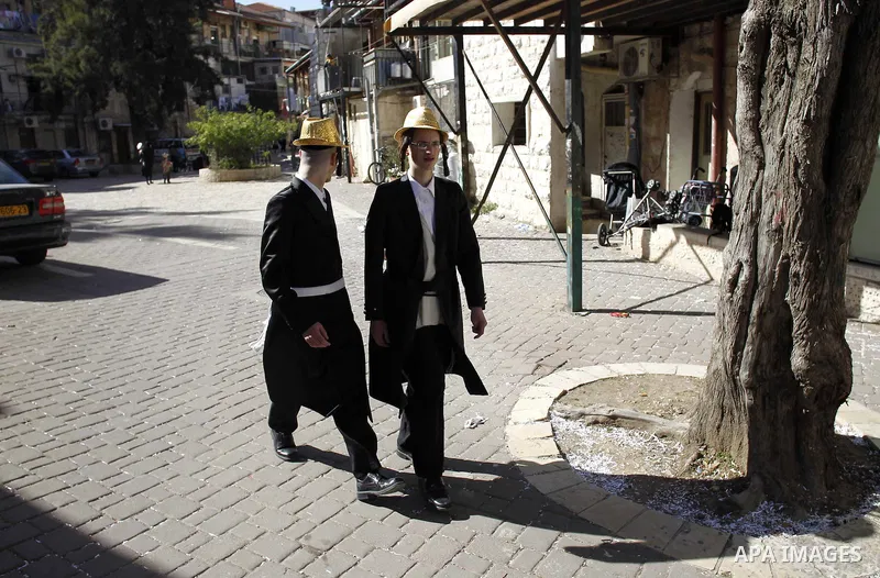 Ultra-Orthodox Jews dressed in costumes during celebrations marking the Jewish holiday of Purim in Jerusalem's Mea Shearim neighbourhood March 6, 2015. Purim is a celebration of the Jews' salvation from genocide in ancie...