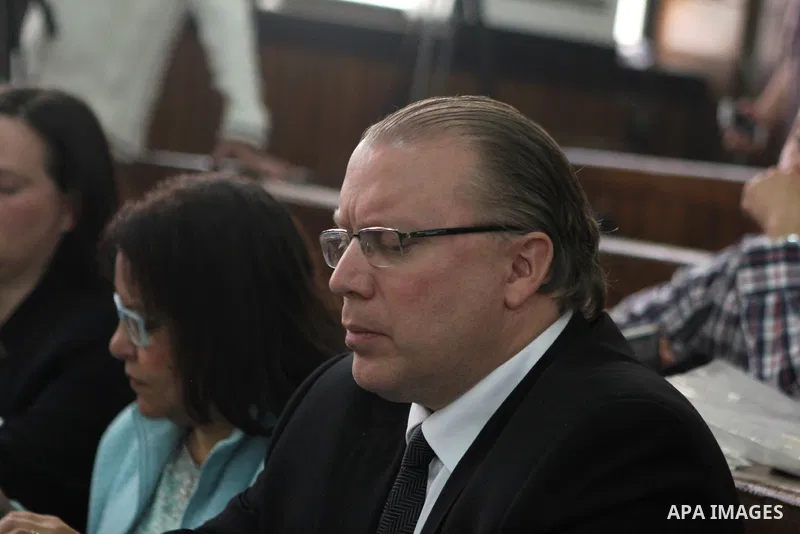 Relatives of defendants in the Marriott terror cell case attend the trial in Cairo on March 8, 2015. The court adjourned the retrial of two Al-Jazeera journalists, including Fahmy, freed on bail after more than 400 days...