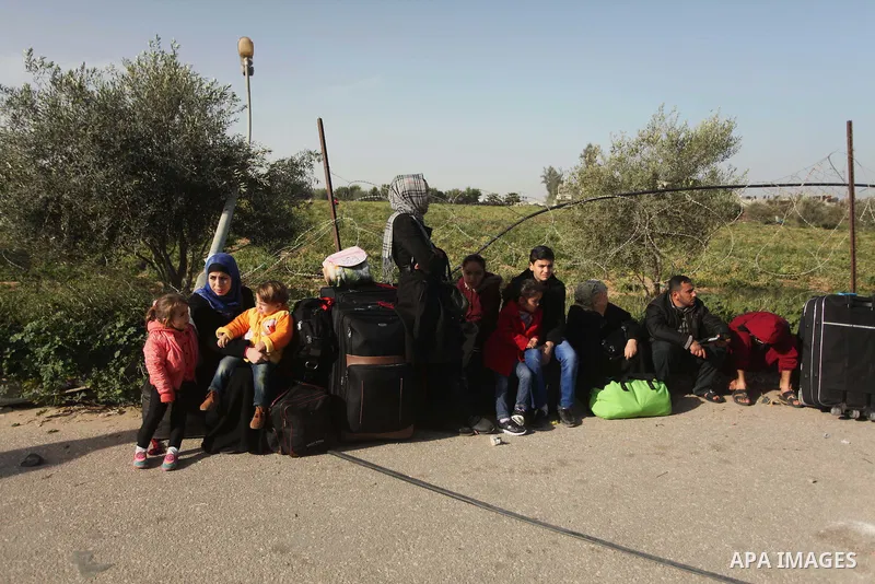 Palestinians wait to cross into Egypt, at the Rafah crossing between Egypt and the southern Gaza Strip March 9, 2015. Egyptian authorities opened the Rafah border crossing on Monday for two days, officials said. Rafah is...