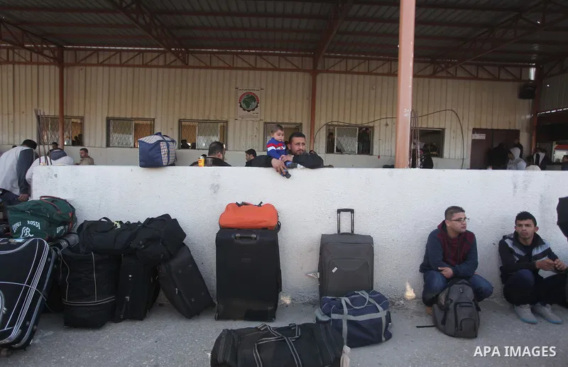 Palestinians wait to cross into Egypt, at the Rafah crossing between Egypt and the southern Gaza Strip March 9, 2015. Egyptian authorities opened the Rafah border crossing on Monday for two days, officials said. Rafah is...