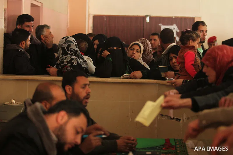 Palestinians ask for travel permits to cross into Egypt, at the Rafah crossing between Egypt and the southern Gaza Strip March 9, 2015. Egyptian authorities opened the Rafah border crossing on Monday for two days, offici...