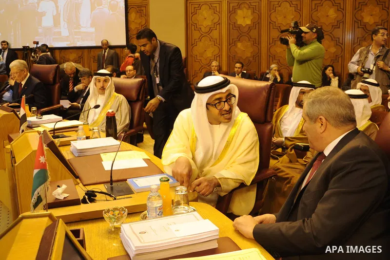 The United Arab Emirates Foreign Minister Sheik Abdullah bin Zayed Al Nahyan, left, talks to his Jordanian counterpart Nasser Judeh, during an Arab foreign ministers meeting at the Arab League headquarters in Cairo March...