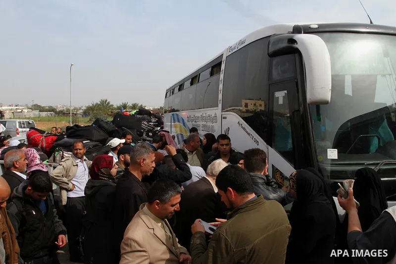 Palestinians wait to cross into Egypt, at the Rafah crossing between Egypt and the southern Gaza Strip March 10, 2015. Egyptian authorities opened the Rafah border crossing on Monday for two days, officials said. Rafah i...