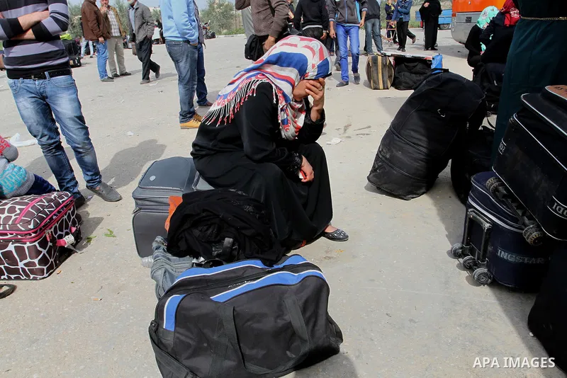 Palestinians wait to cross into Egypt, at the Rafah crossing between Egypt and the southern Gaza Strip March 10, 2015. Egyptian authorities opened the Rafah border crossing on Monday for two days, officials said. Rafah i...