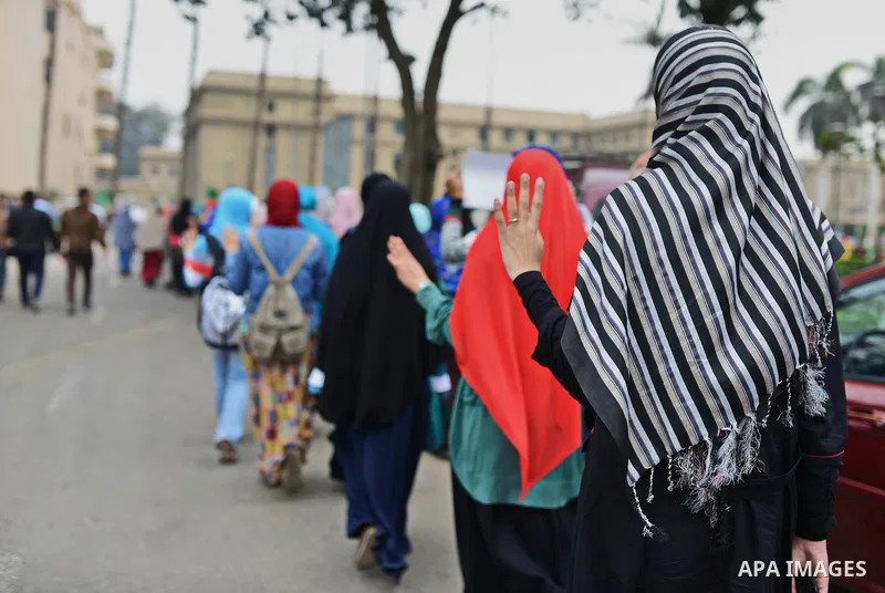 Egyptian students who support Muslim Brotherhood and ousted president Mohammed Morsi, flashes Rabaa sign during a demonstration against military rule, at Cairo University, in Cairo, March 10, 2015. Photo by Amr Sayed