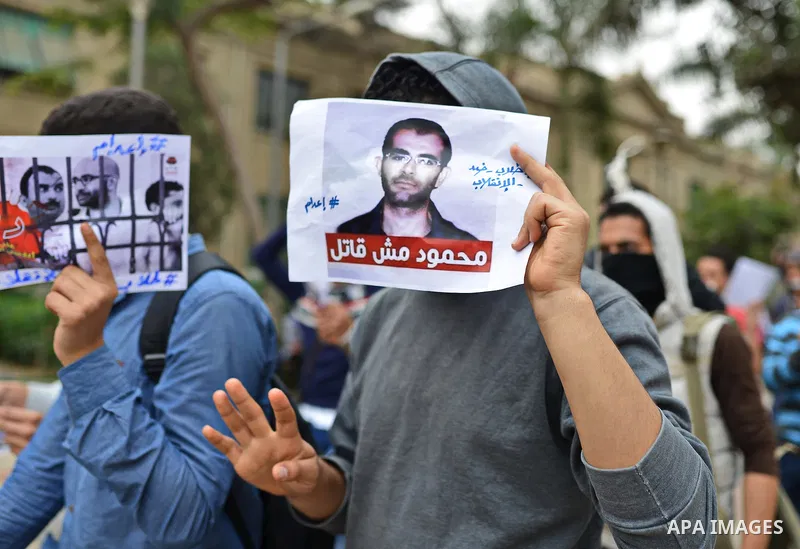 Egyptian students who support Muslim Brotherhood and ousted president Mohammed Morsi, hold pictures of their fellows during a demonstration against military rule, at Cairo University, in Cairo, March 10, 2015. Photo by A...