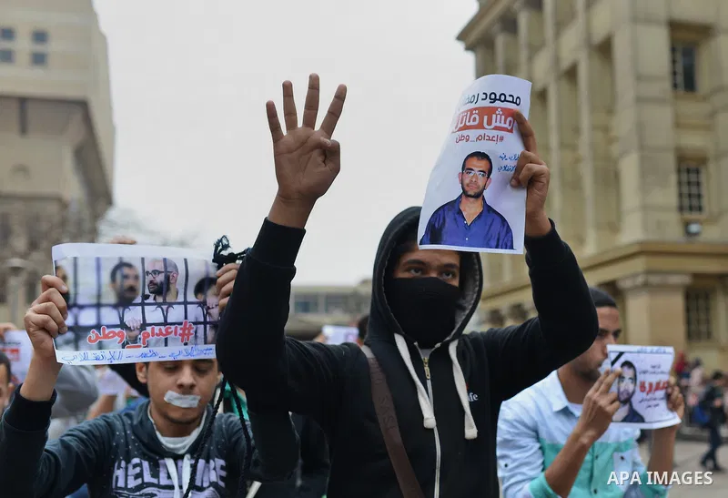 Egyptian students who support Muslim Brotherhood and ousted president Mohammed Morsi, hold pictures of their fellows during a demonstration against military rule, at Cairo University, in Cairo, March 10, 2015. Photo by A...