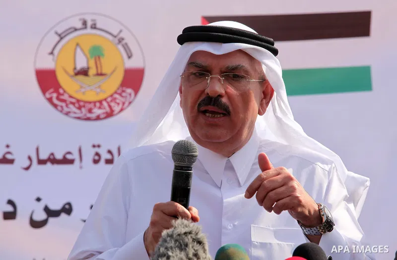 Qatar's Ambassador to the Palestinian Authority, Mohammed Al Emadi speaks during a press conference in front of the rubbles of El-Wafa hospital, which witnesses said was destroyed during a seven-week Israeli offensive, i...