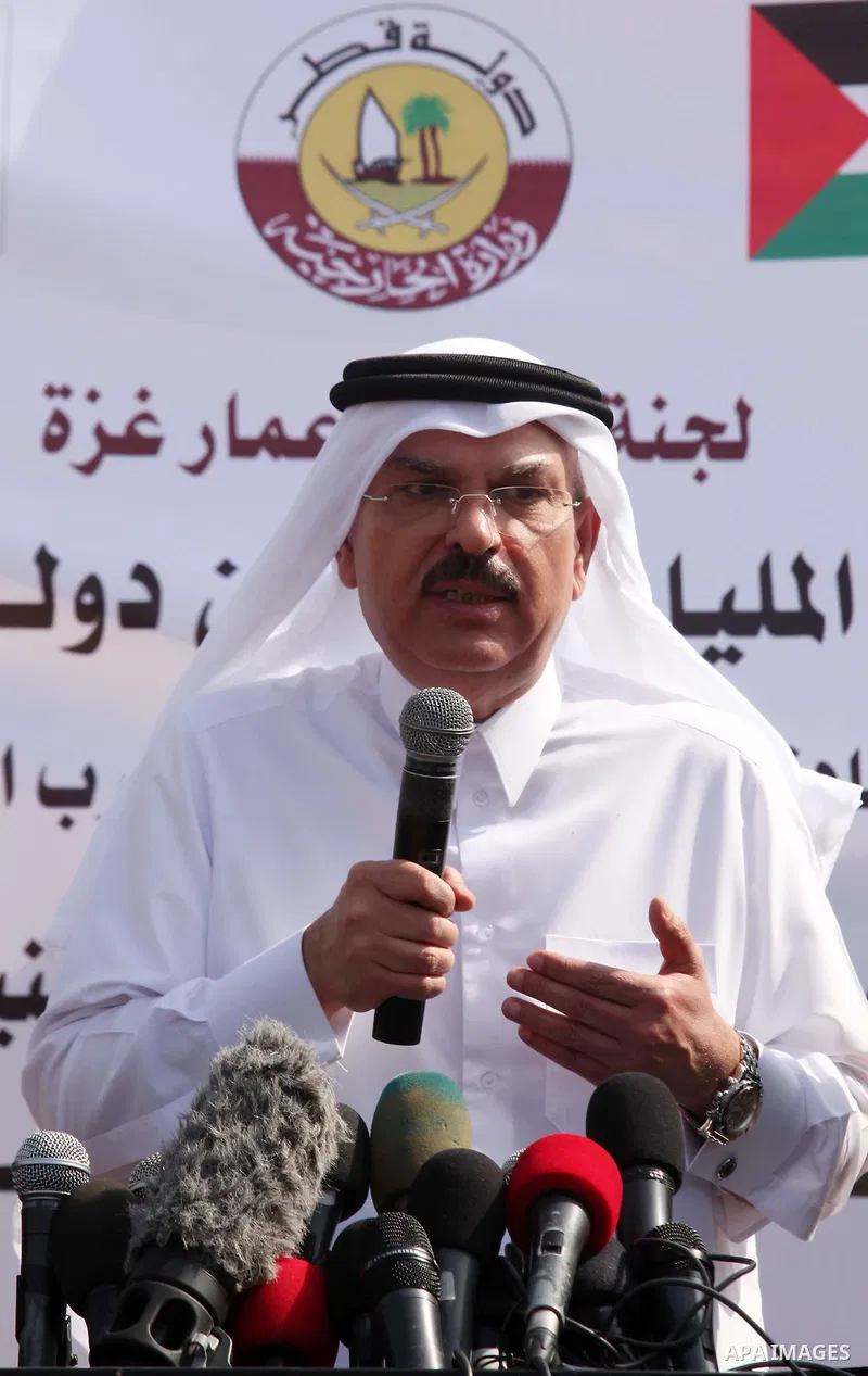 Qatar's Ambassador to the Palestinian Authority, Mohammed Al Emadi speaks during a press conference in front of the rubbles of El-Wafa hospital, which witnesses said was destroyed during a seven-week Israeli offensive, i...