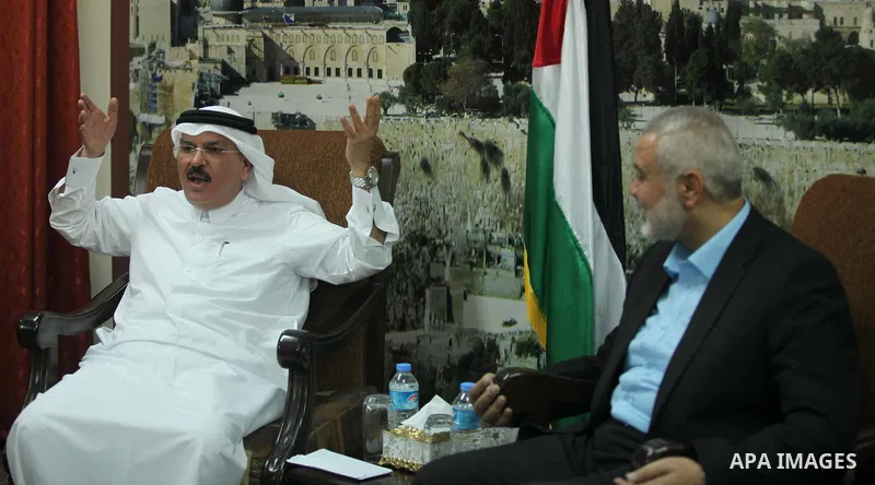 Senior Hamas leader Ismail Haniyeh meets with Qatar's Ambassador to the Palestinian Authority, Mohammed Al Emadi at his home, in Gaza city, on March 12, 2015. Photo by Ashraf Amra